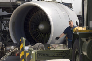 Staff Sgt. Sean Donovan directs a crane into position while preparing to mount an engine on a C-5 Galaxy on May 12, 2006, at Ramstein Air Base Germany.  Sergeant Donovan is a jet engine mechanic assigned to the 723rd Air Mobility Squadron. (U.S. Air Force photo/Master Sgt. John E. Lasky)
